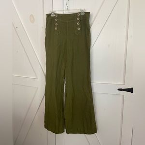 The most adorable olive green pants with wood buttons that have anchors on them